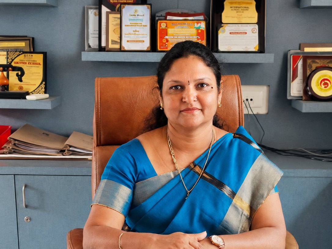 Amudha R, Principal of Vikas Vidyalaya Juniors, at her desk
